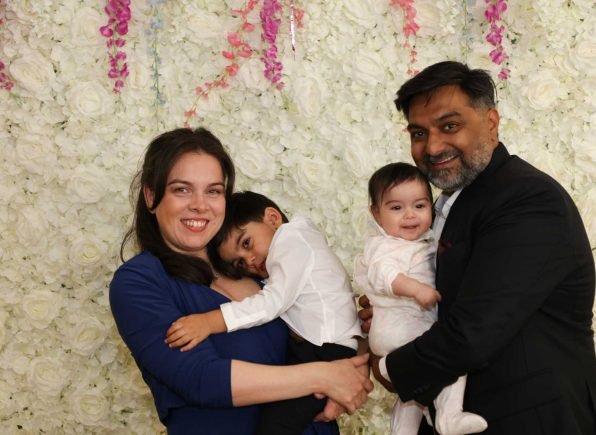 Family_on_flowerwall_background